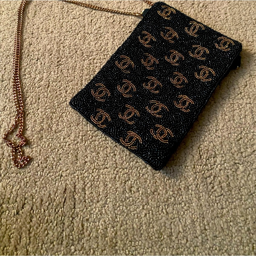 NWOT Black crossbody fabric bag with “Chanel” logo beading on front. 7 1/2 by 5